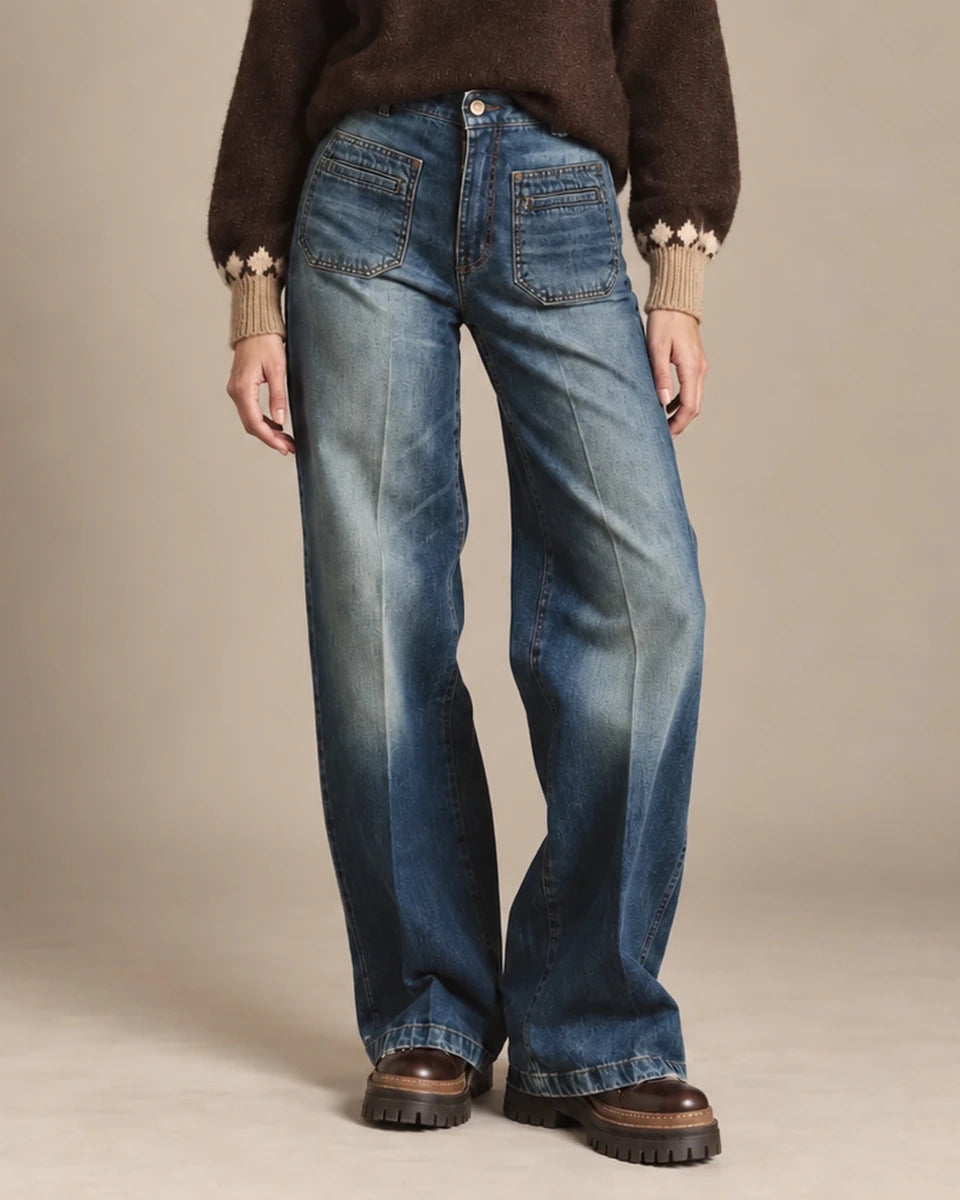 Amber blue patch-pocket jeans shown from the waist to the hem, styled with brown boots.