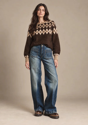 Odessa brown diamond-knit sweater styled with Amber blue patch-pocket jeans, full-length front view on a model.