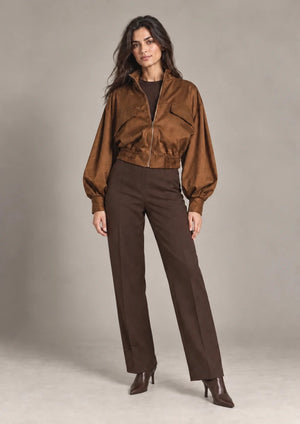 Carlotta Moro cropped zip jacket with voluminous sleeves and a gathered hem, shown in a full-length outfit.