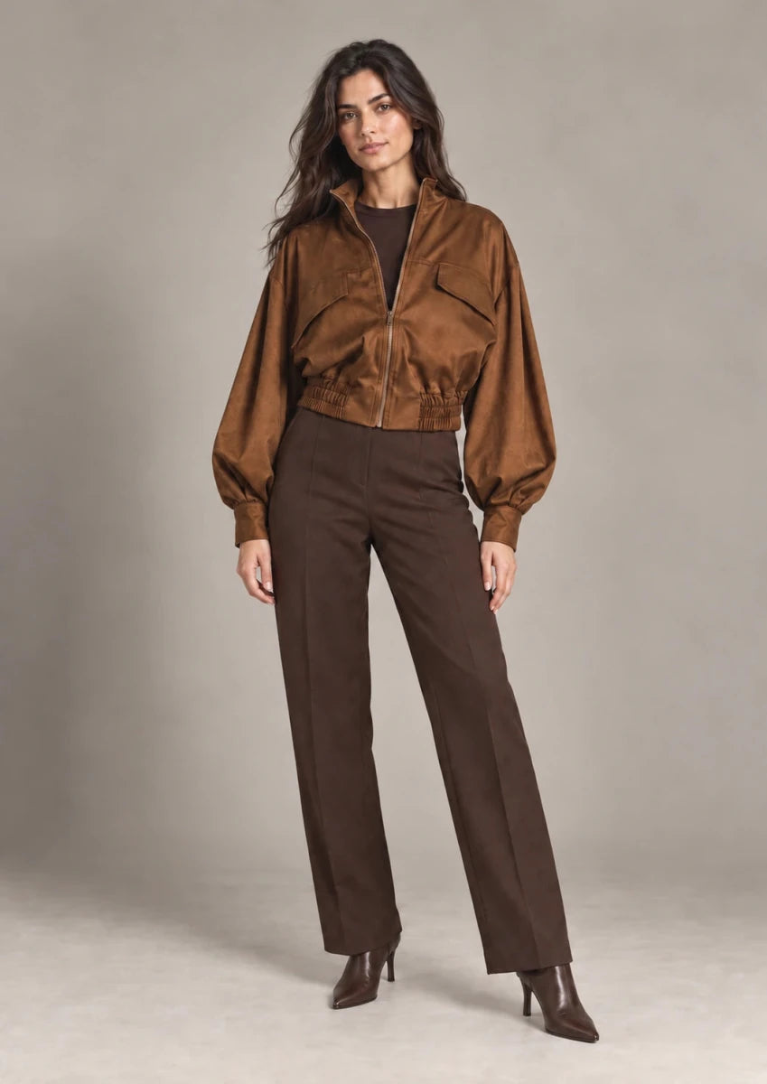 Carlotta Moro cropped zip jacket with voluminous sleeves and a gathered hem, shown in a full-length outfit.