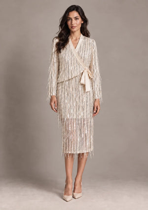 Full-length front view of the Cassandra Panna fringe wrap jacket and matching Consuelo cream sequin skirt.