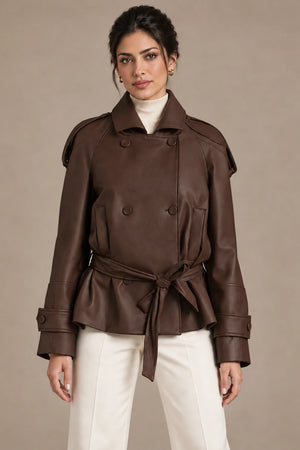 Front view of the brown Clara Moro jacket worn belted over an ivory top and trousers.