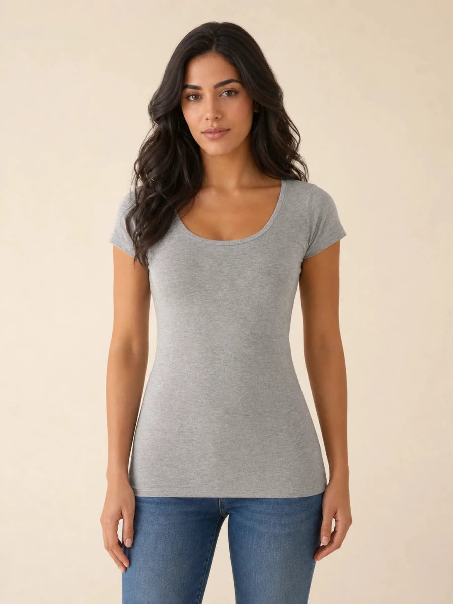 Grey scoop-neck cap-sleeve top worn untucked with blue jeans, front view