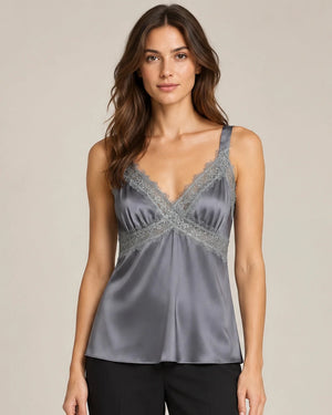 Close-up of the grey Domitilla camisole worn untucked, showing the lace-trimmed neckline and gathered front.