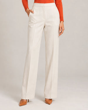 Front detail of the ivory Elisa Panna tailored trousers showing the waistband, pockets and wide legs.