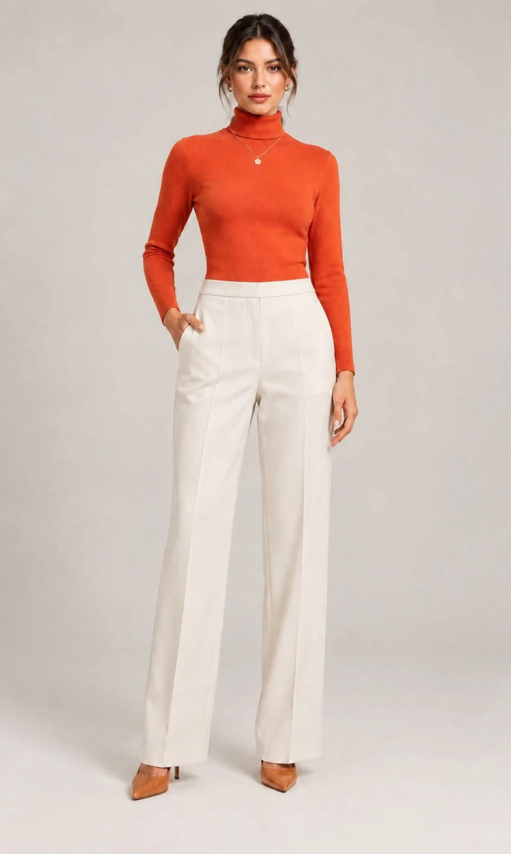Full-length front view of the ivory Elisa Panna tailored trousers, styled with an orange long-sleeve top.