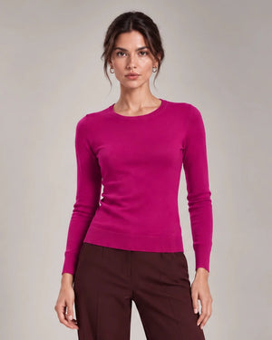 Front detail of Livia Fuchsia crew-neck knit top with long sleeves and ribbed trims.