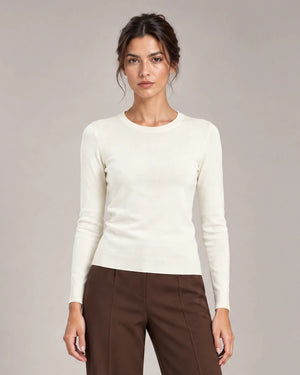 Front detail of Livia Panna crew-neck knit top with long sleeves and ribbed trims.
