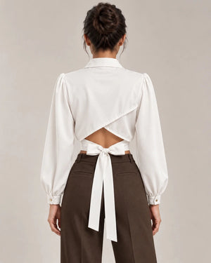 Back view of Mirella cropped shirt in Bianco Seta, showing crossover panels, a lower-back cut-out and waist ties.