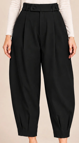 Front detail of black Queen Nero barrel-leg trousers showing the button-detail waistband, front pleats and pleated ankle hems.