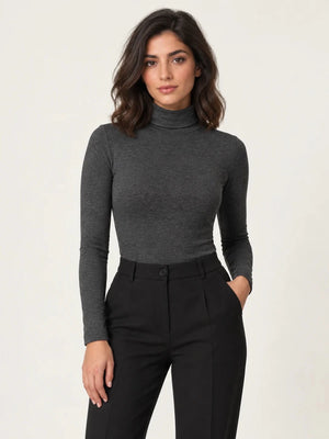 Dark mélange grey stretch-blend turtleneck long-sleeve top styled with black trousers, front view