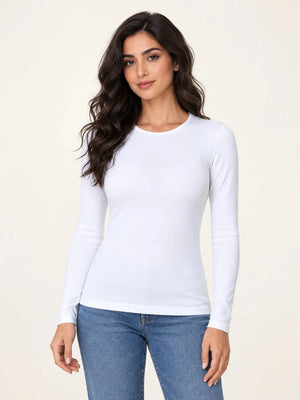 White stretch-cotton crew-neck long-sleeve top worn untucked with blue jeans, front view