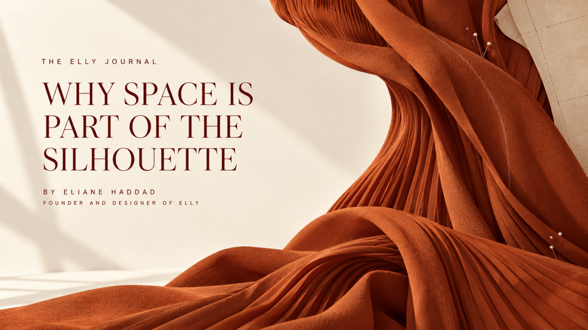 Sculptural burnt-orange pleated fabric illustrating space, drape and movement for the ELLY Journal
