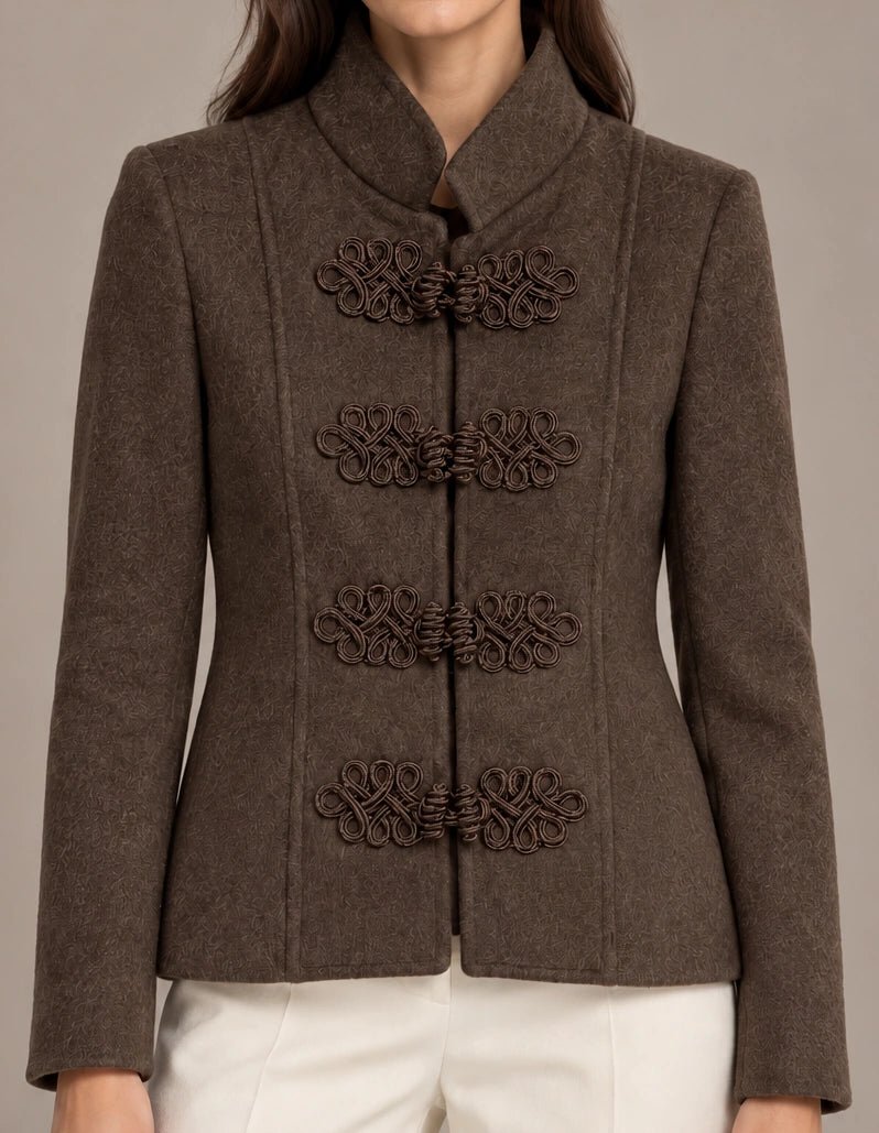 Close-up of the brown Allegra Moro Toggle Jacket showing the stand collar and decorative frog closures.