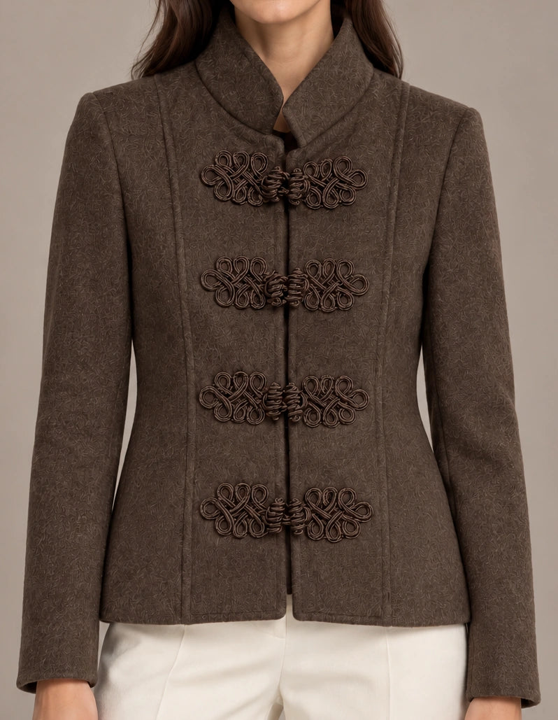 Close-up of the brown Allegra Moro Toggle Jacket showing the stand collar and decorative frog closures.