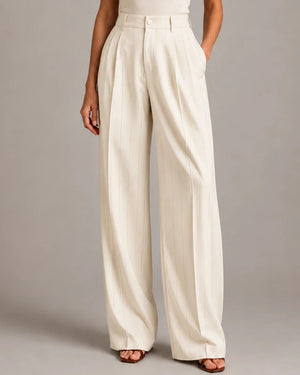 Front detail of the ivory Amata Panna wide-leg trousers showing fine gold-coloured vertical pinstripes and front pleats.