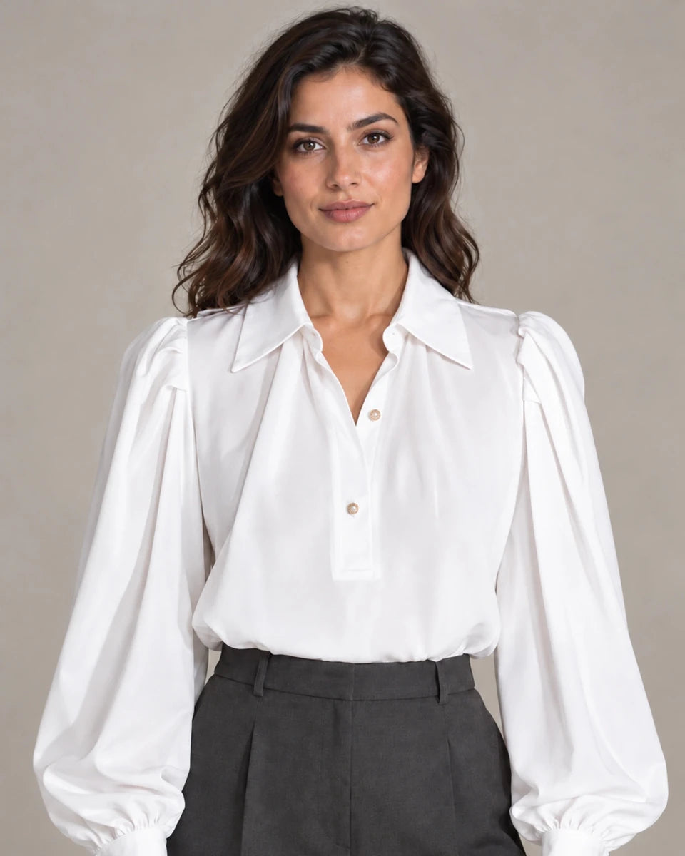 Close-up of Camicia Plissé Bianco white puff-sleeve blouse with an open collar and gold-tone buttons