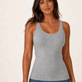 Grey longline tank top worn with blue jeans, front view