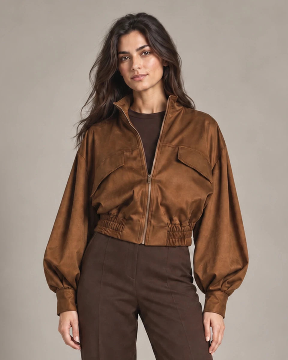 Close-up of Carlotta Moro jacket showing the front zip, chest flap details and gathered cropped hem.