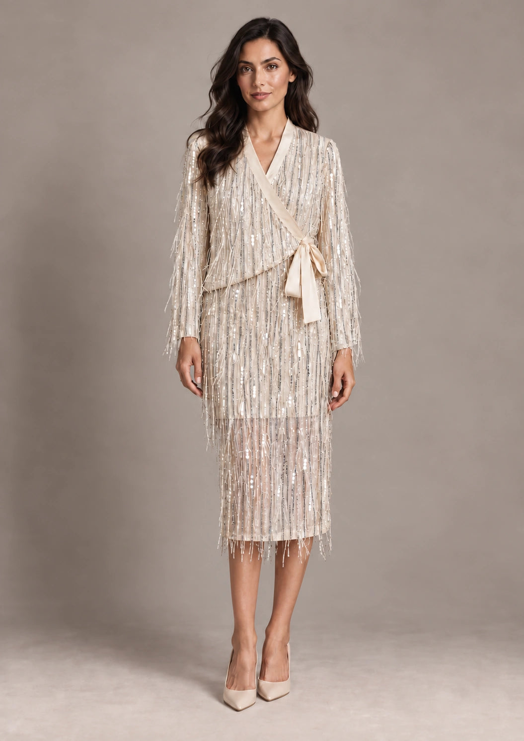 Full-length front view of the Cassandra Panna fringe wrap jacket and matching Consuelo cream sequin skirt.