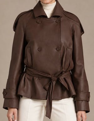 Close-up of the brown Clara Moro jacket showing the tied waist belt, double-breasted buttons and shoulder details.