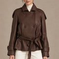 Front view of the brown Clara Moro jacket worn belted over an ivory top and trousers.