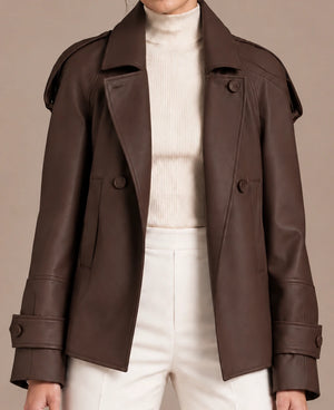Close-up of the brown Clara Moro jacket worn open, showing its collar, buttons and sleeve straps.