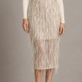 Front detail of the Consuelo cream sequin skirt showing its shimmering fringe and sheer lower section.