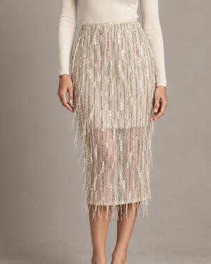 Front detail of the Consuelo cream sequin skirt showing its shimmering fringe and sheer lower section.