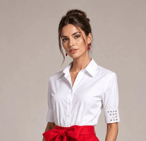 White button-front shirt with crystal-embellished cuffs, worn with a red bow-waist skirt, front view