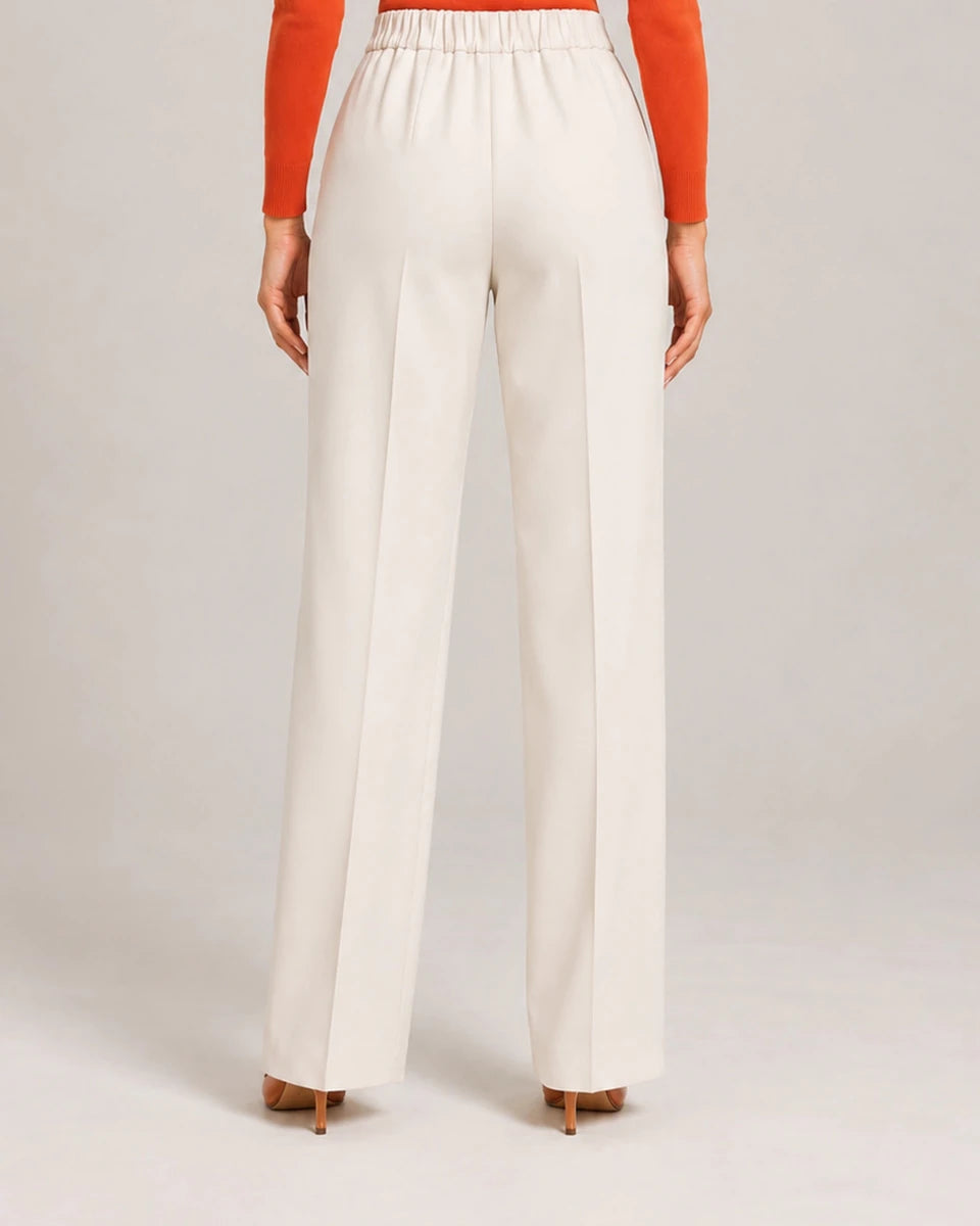 Rear detail of the ivory Elisa Panna tailored trousers showing the gathered waistband and wide legs.