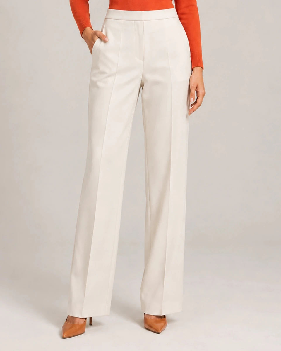 Front detail of the ivory Elisa Panna tailored trousers showing the waistband, pockets and wide legs.