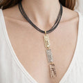Leather necklace featuring zamak metal and rhodium plating in gold, rose gold, and silver. - ELLY