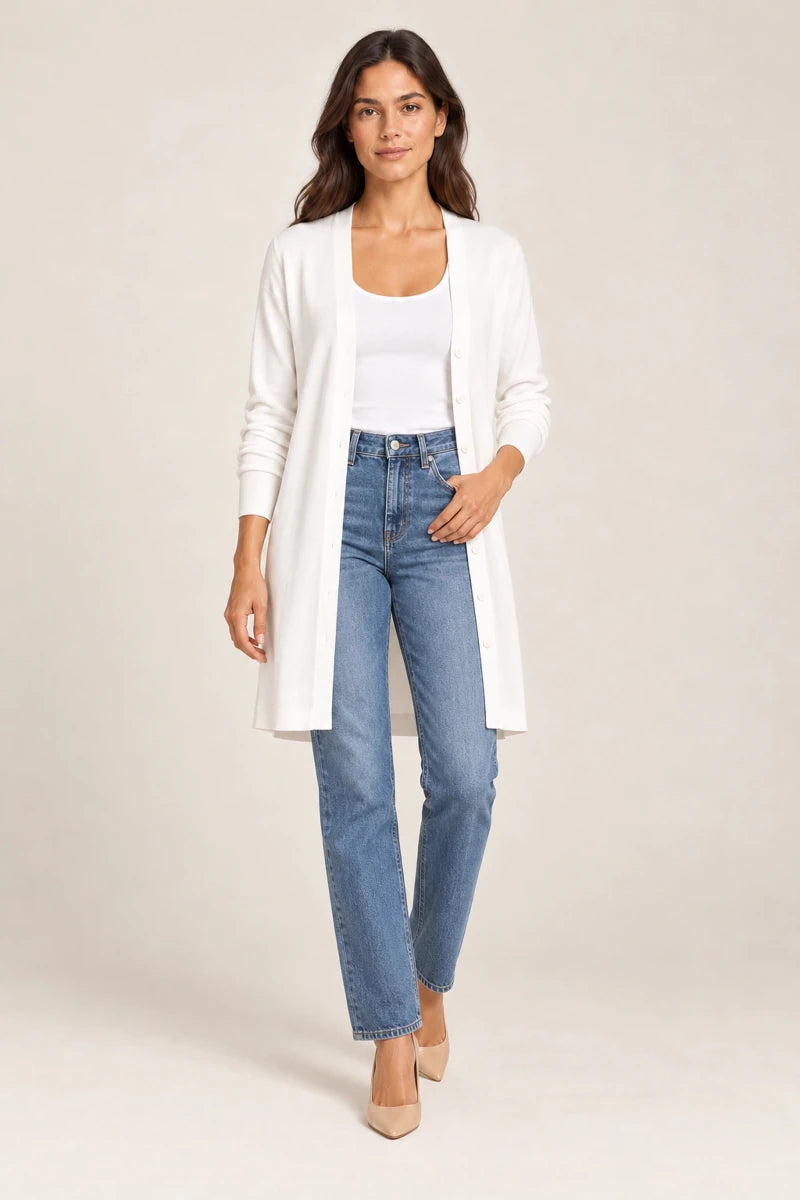 Model wearing ELLY's white Lightweight Open-Front Cardigan over a white top with blue jeans and beige heels, full-length view.