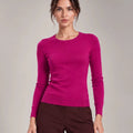 Front detail of Livia Fuchsia crew-neck knit top with long sleeves and ribbed trims.