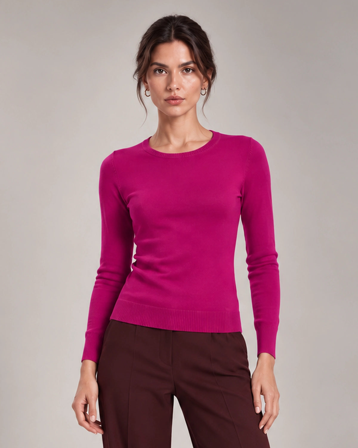 Front detail of Livia Fuchsia crew-neck knit top with long sleeves and ribbed trims.