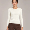 Front detail of Livia Panna crew-neck knit top with long sleeves and ribbed trims.