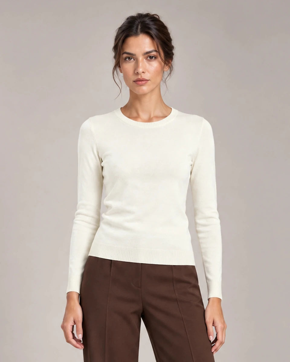 Front detail of Livia Panna crew-neck knit top with long sleeves and ribbed trims.