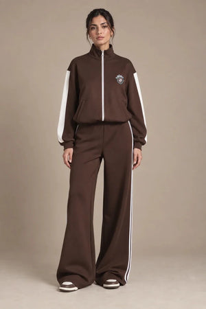 Front view of Leila Moro zip track jacket and Mara wide-leg track pants with contrasting white stripes.