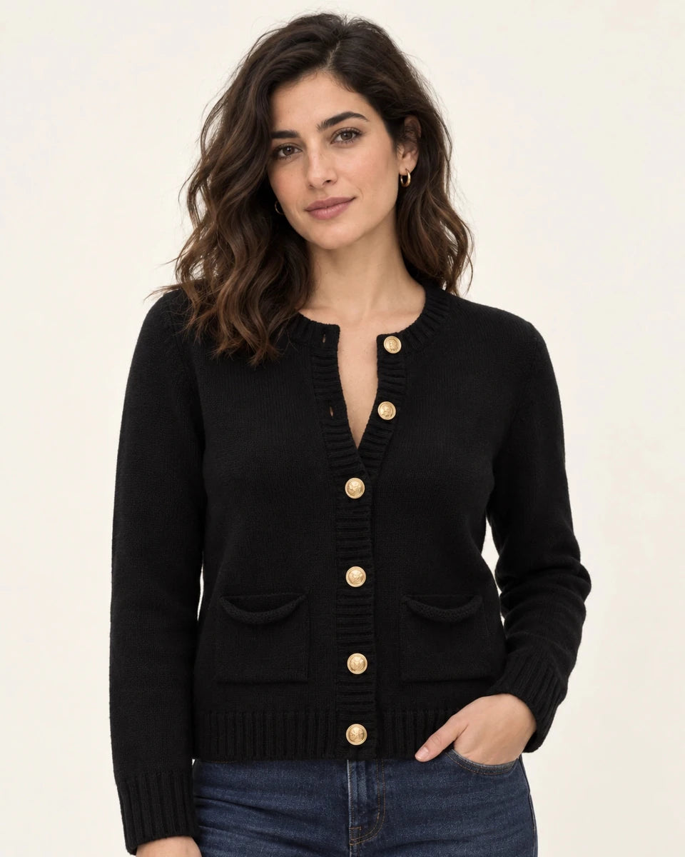Close-up of Mariana black knit cardigan with gold-tone buttons, front patch pockets and ribbed edges