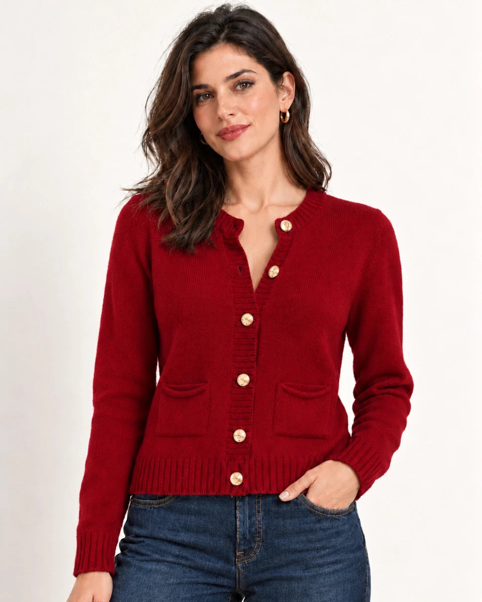 Close-up of Mariana red knit cardigan with gold-tone buttons, front patch pockets and ribbed edges