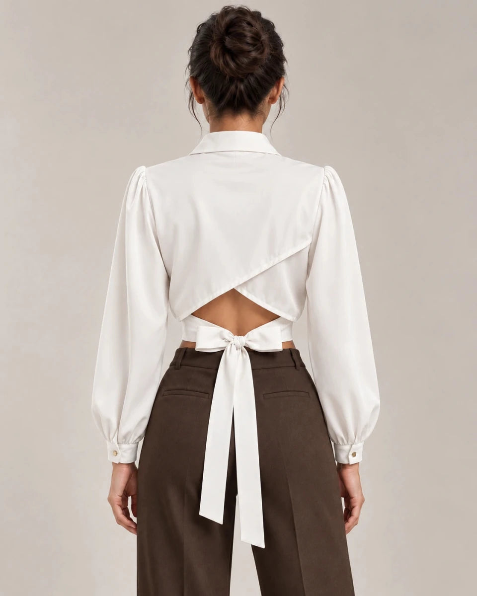 Back view of Mirella cropped shirt in Bianco Seta, showing crossover panels, a lower-back cut-out and waist ties.