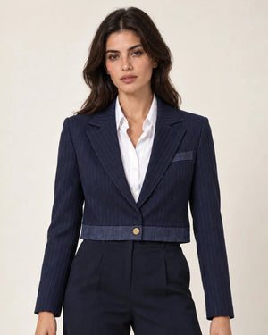 Moana navy pinstripe cropped jacket with a chest pocket and contrast hem, worn over a white top