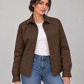 Front view of the dark brown Moro Mist Windbreaker Jacket worn open over a white top and jeans, showing the collar and snap fastenings.