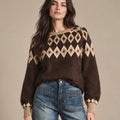 Close-up of Odessa brown knit sweater showing the beige diamond yoke, ribbed neckline and long sleeves.