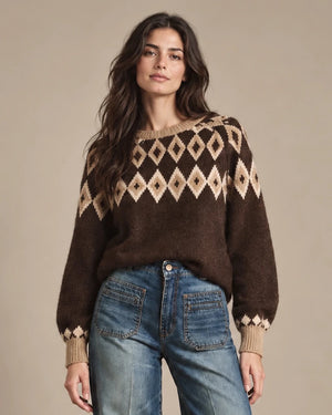 Close-up of Odessa brown knit sweater showing the beige diamond yoke, ribbed neckline and long sleeves.