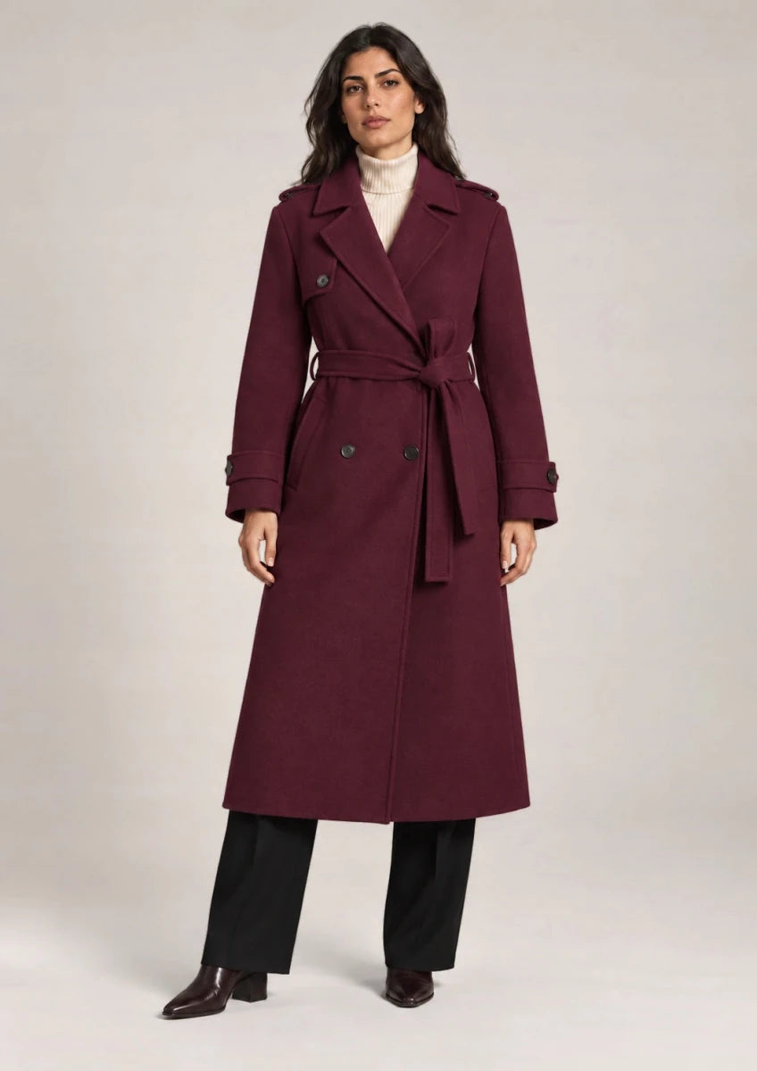 Full-length front view of the Persia Bordeaux coat with notched lapels, double-breasted buttons and a tied waist belt.