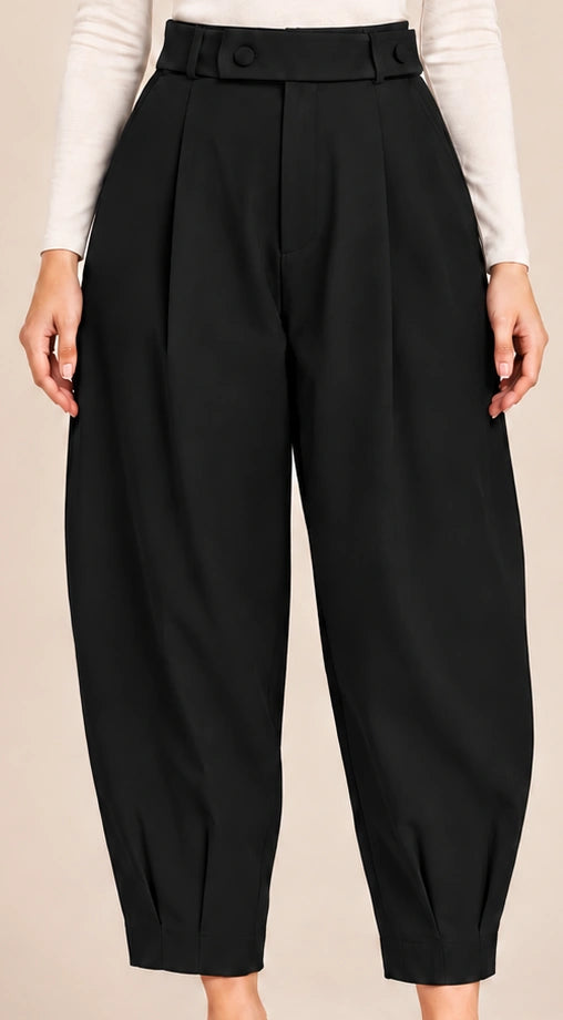 Front detail of black Queen Nero barrel-leg trousers showing the button-detail waistband, front pleats and pleated ankle hems.