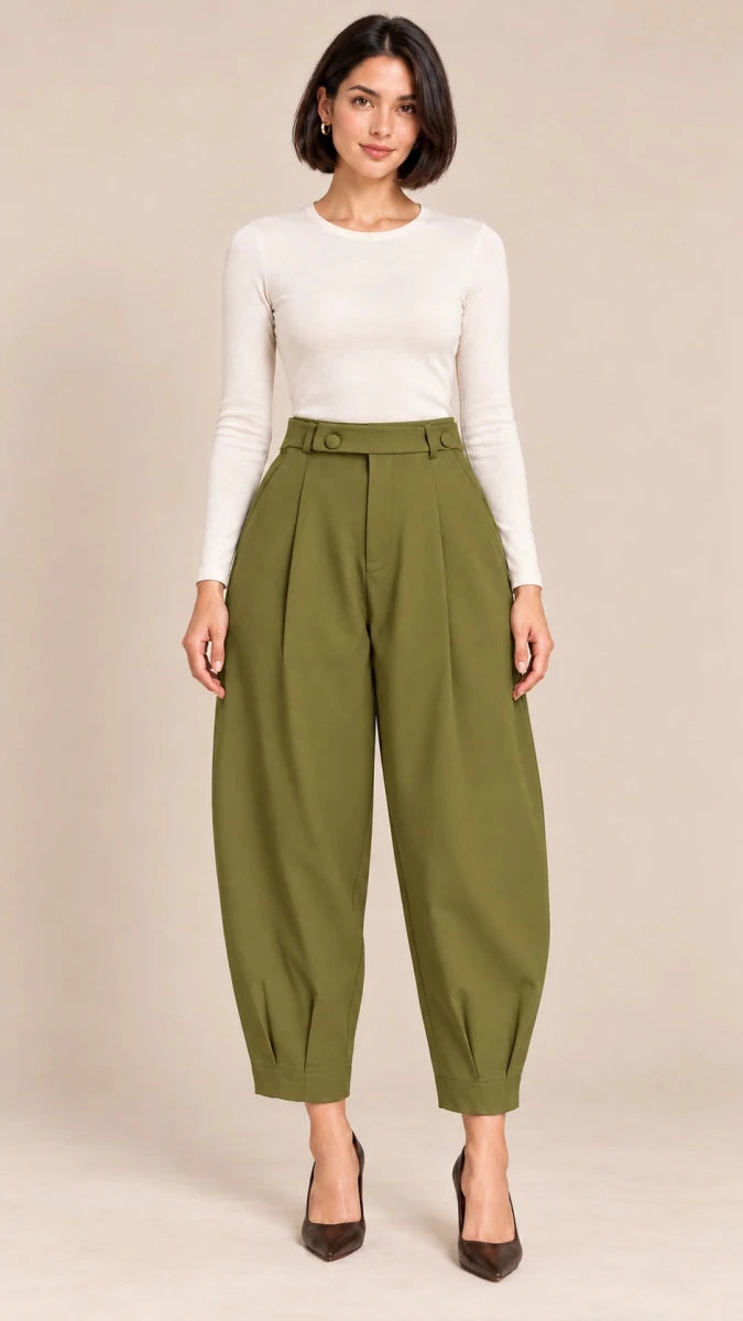 Full-length front view of olive green Queen barrel-leg trousers with a button-detail waistband and pleated ankle hems, worn with an ivory top.