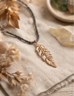 Rhodium coated brass pendant on a metallic string - ELLY